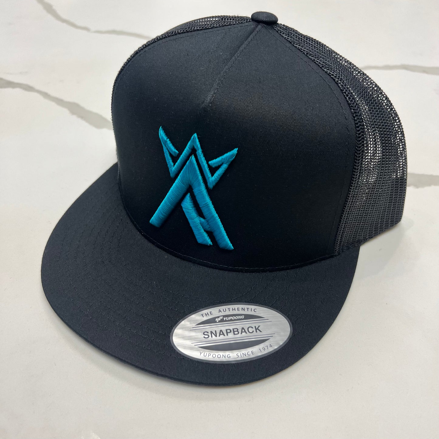 Teal King Arctic Blk/Blk Trucker Hat