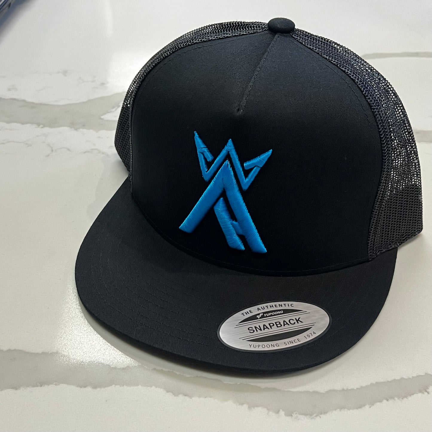 King Arctic L. Blue BLK Trucker Hat